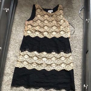 Short, slimming, black and cream dress